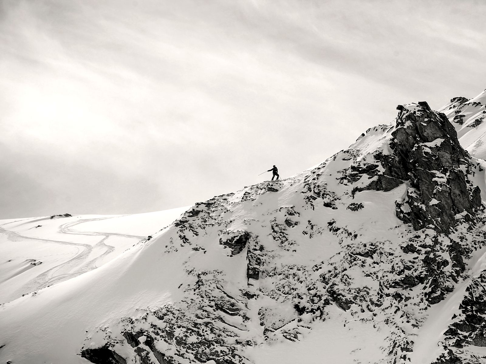Freeride skier on a steep face in the Val d'Anniviers