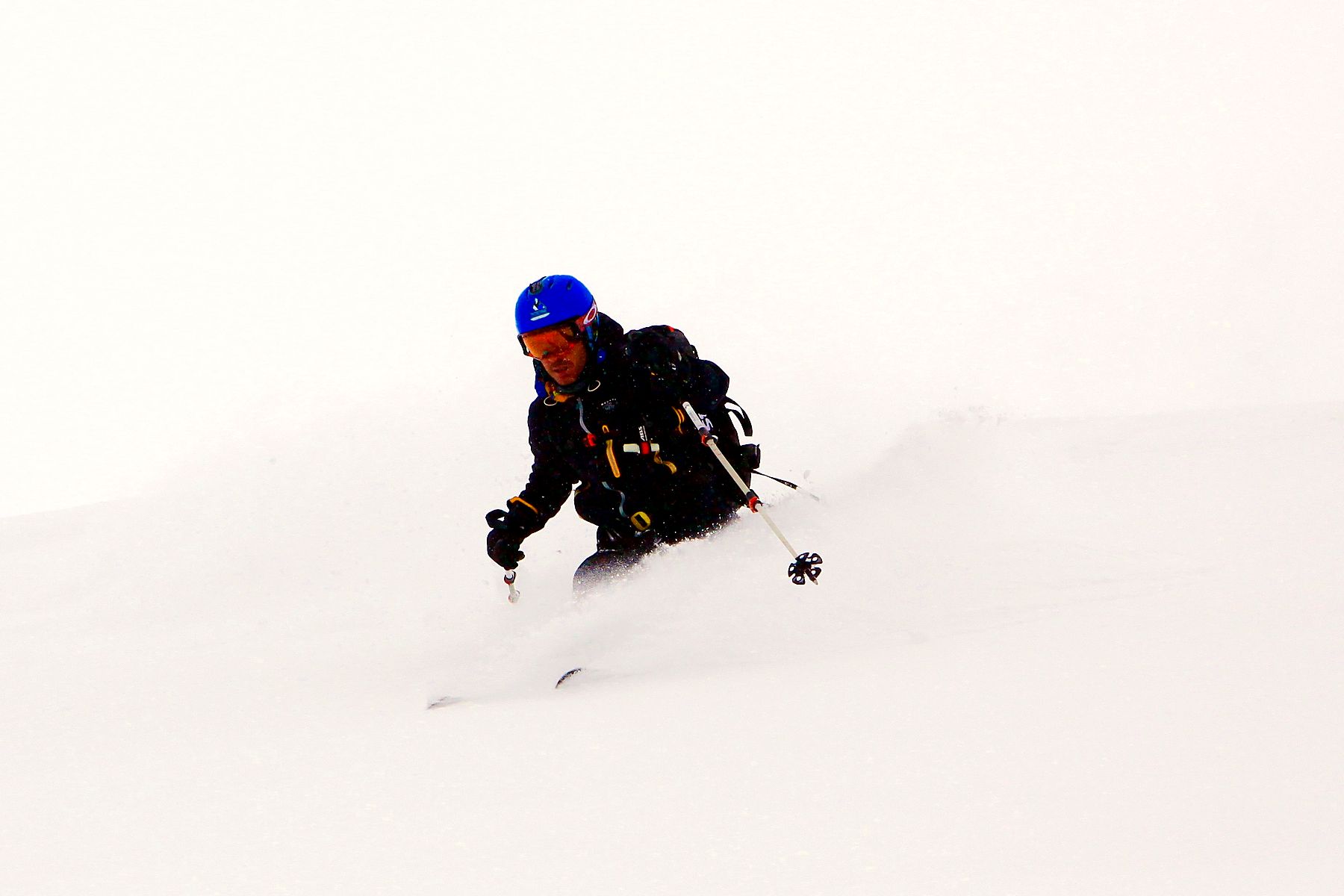 Off-piste powder skiing on a cloudy day in the Valais