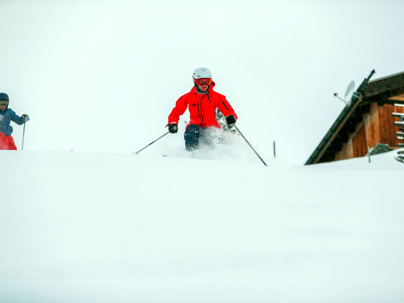 Powder skiing above the chalets in the Valais
