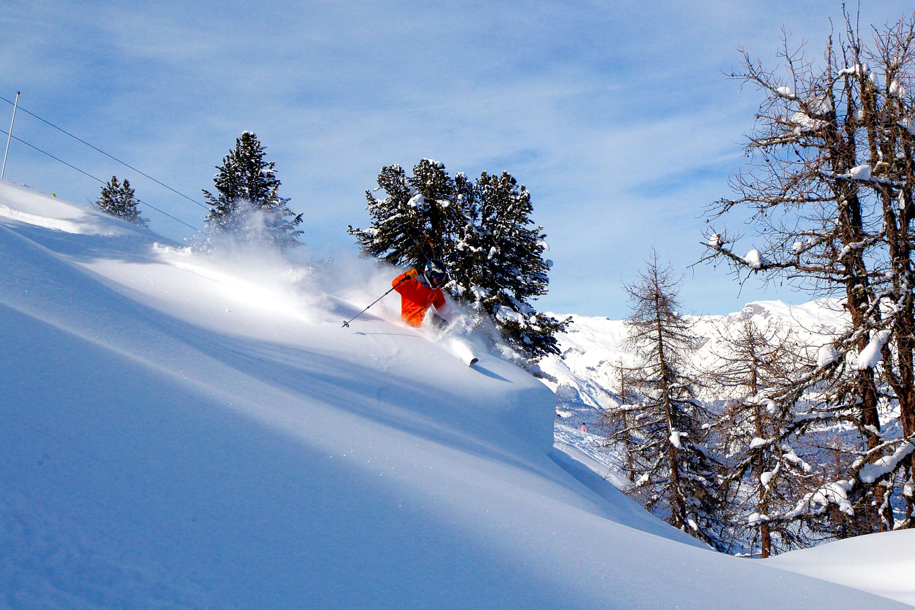 Deep powder skiing in remote mountain terrain with Le Beau Ski