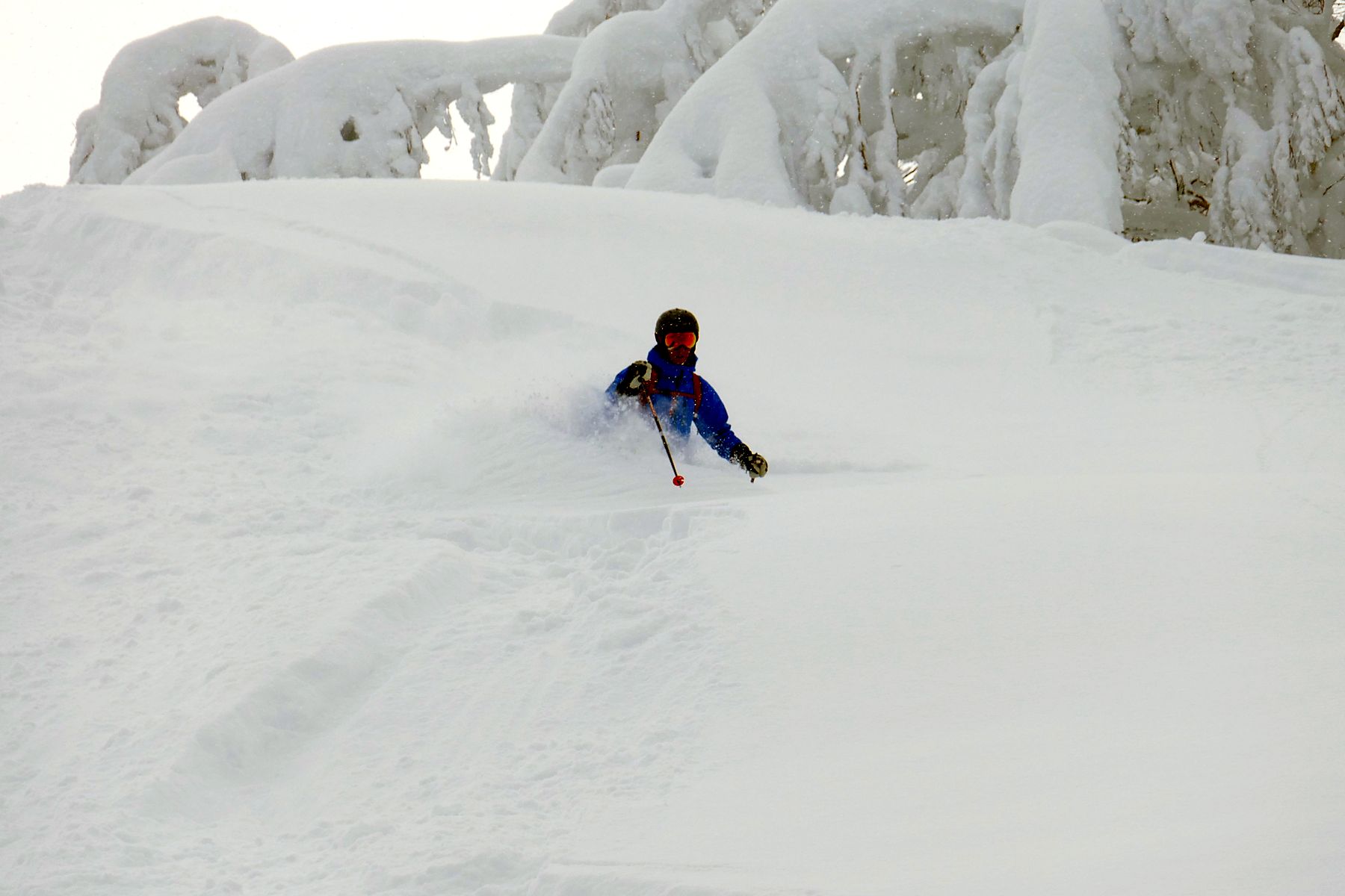 Deep powder face shot skiing with Le Beau Ski guides