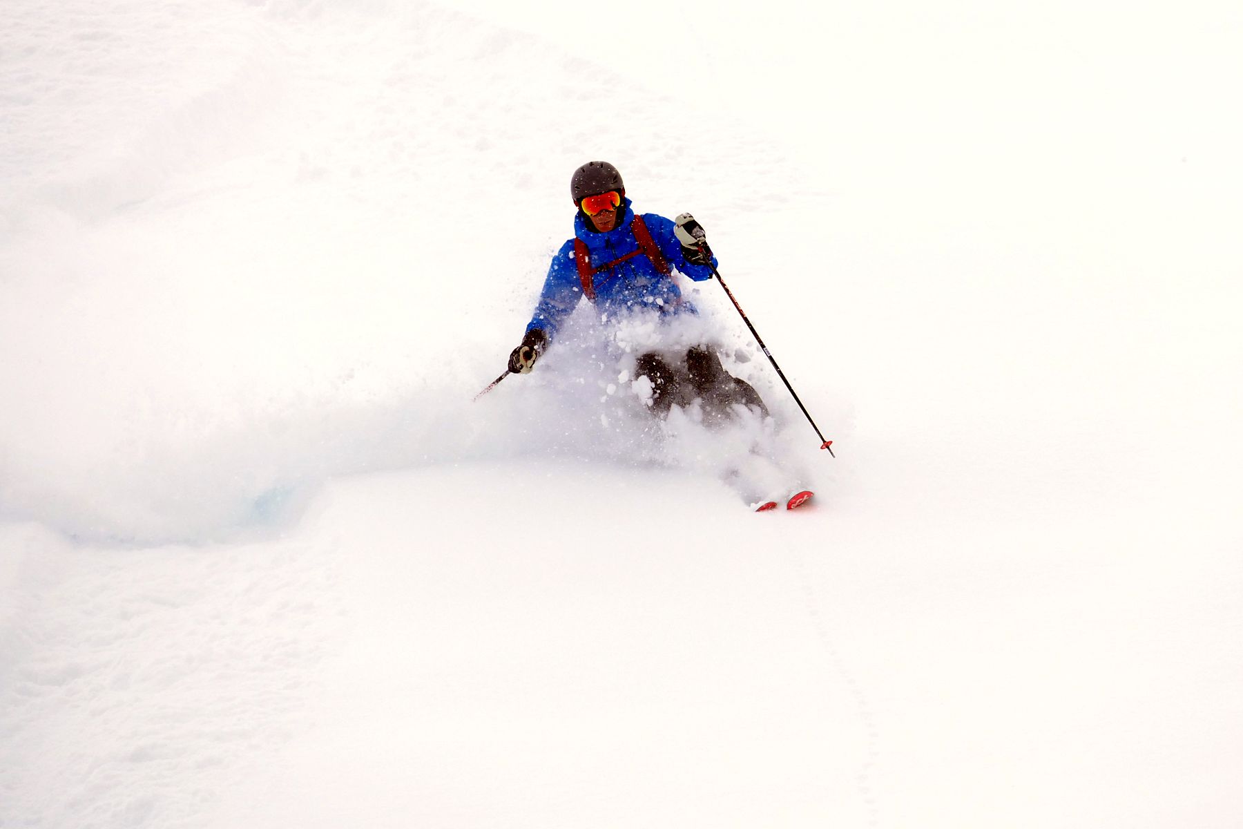 Deep powder turn in cold smoke snow with Le Beau Ski guides